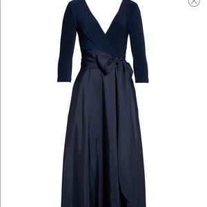 Navy Alfred Sung formal gown with bow sash.